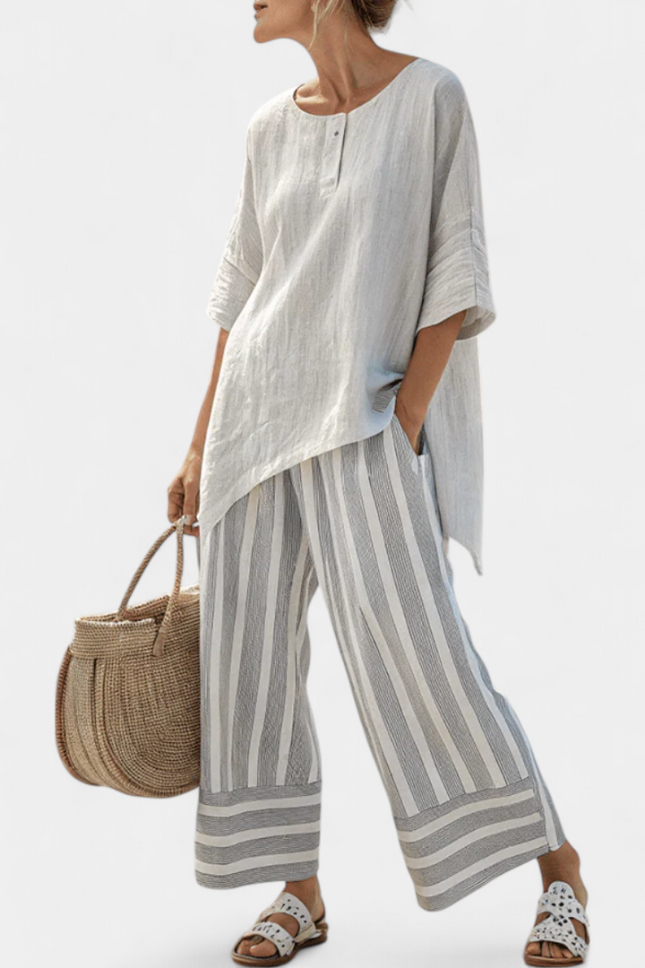 Fiorella – Elegant asymmetric blouse and striped pants